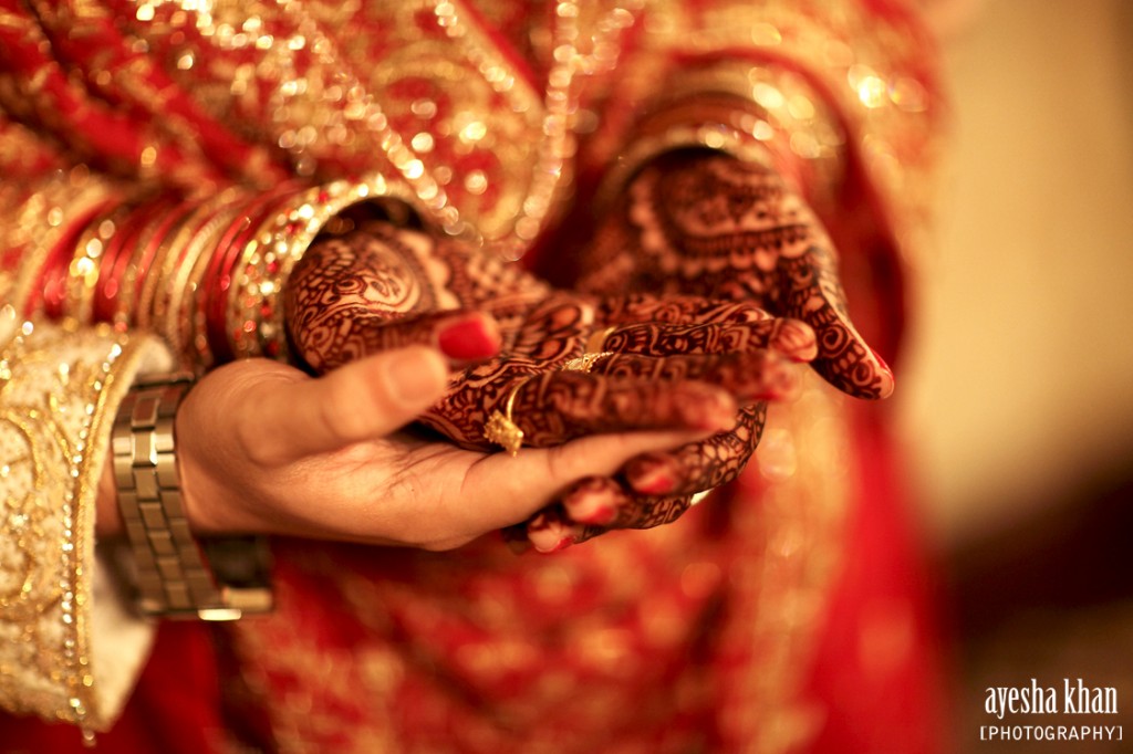 The bride and groom Sana and Shahzeb holding hands at rukhsati wedding reception. Sana's bridal henna by Sumeyya of Henna Craze. Photography by Ayesha Khan - The Muslim Bride The bride and groom Sana and Shahzeb holding hands at rukhsati wedding reception The Muslim Bride 1024x682 The Muslim Bride Special Wedding Feature: Sana and Shahzebs Wedding Reception